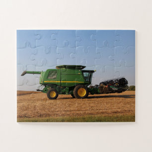 Green tractor harvesting a field jumbo jigsaw puzzle