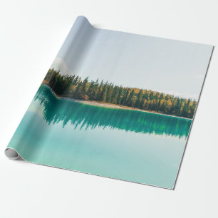 GREEN TREES BESIDE BODY OF WATER DURING DAYTIME WRAPPING PAPER
