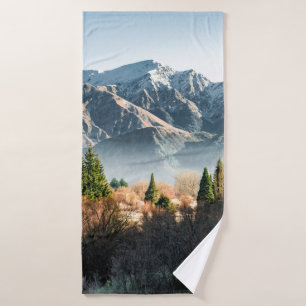GREEN TREES NEAR SNOW COVERED MOUNTAIN DURING DAYT BATH TOWEL