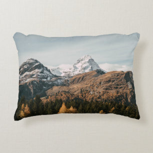 GREEN TREES NEAR SNOW COVERED MOUNTAIN DURING DAYT DECORATIVE CUSHION