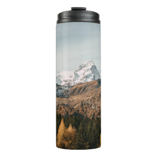 GREEN TREES NEAR SNOW COVERED MOUNTAIN DURING DAYT THERMAL TUMBLER