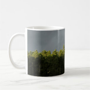 GREEN TREES UNDER CLOUDY SKY COFFEE MUG
