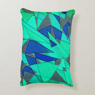 Green triangular cutouts on blue background, rough decorative cushion