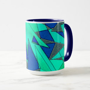Green triangular cutouts on blue background, rough mug