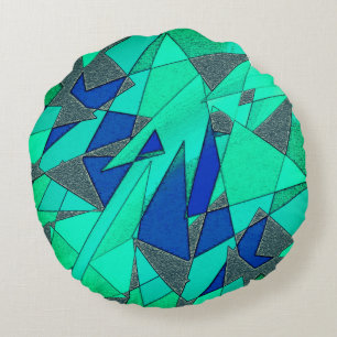 Green triangular cutouts on blue background, rough round cushion