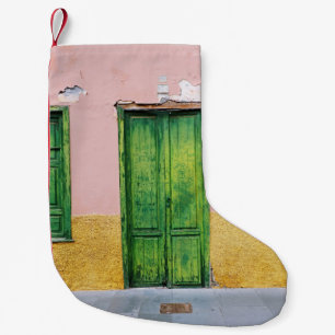 GREEN WOODEN DOOR ON WHITE CONCRETE WALL SMALL CHRISTMAS STOCKING