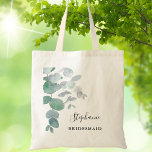 Greenery Eucalyptus Bridesmaid Tote Bag<br><div class="desc">This elegant Bridesmaid Tote Bag is decorated with watercolor eucalyptus leaves in soft shades of green. Easily customisable. To edit further use the Design Tool to change the font, font size, or colour. Because we create our artwork you won't find this exact image from other designers. Original Watercolor © Michele...</div>