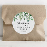 Greenery Eucalyptus Thank You Wedding Favor Classic Round Sticker<br><div class="desc">This modern calligraphy thank you wedding favor classic round sticker is perfect for a rustic wedding. The simple and elegant design features classic and fancy script typography in black and white. Make the sticker labels your own by including your names, the event (if applicable), and the date. These stickers can...</div>