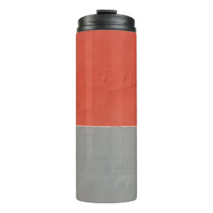 Grey and orange painted wall thermal tumbler