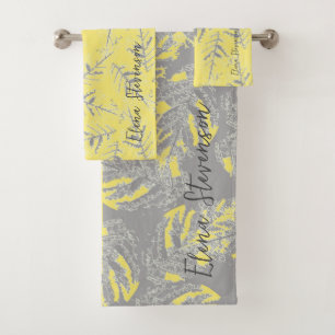 Grey and yellow leaves on a striped background. bath towel set