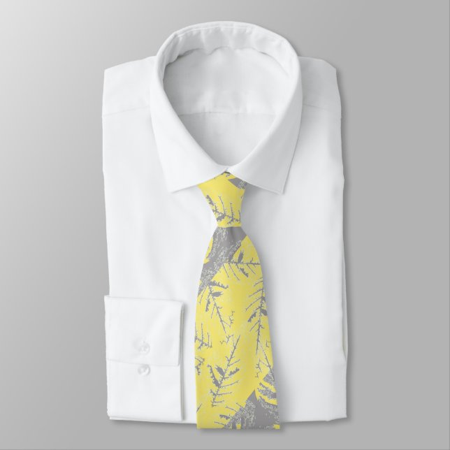Grey and yellow leaves on a striped background.  tie (Tied)