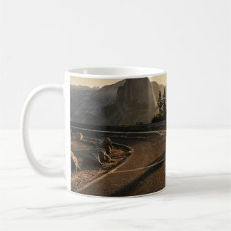 Grey asphalt road near mountain in the morning coffee mug