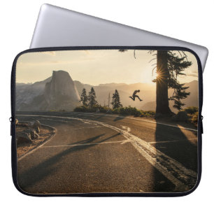 Grey asphalt road near mountain in the morning laptop sleeve