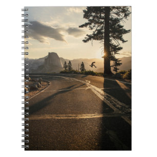 Grey asphalt road near mountain in the morning notebook