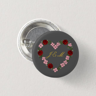 Grey badge with a pink and red heart