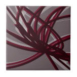 Grey & Burgundy Artistic Abstract Ribbon Ceramic Tile<br><div class="desc">Grey and burgundy ceramic tile features an artistic abstract ribbon composition with shades of burgundy wine and grey with white accents on a grey background.</div>