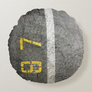 Grey concrete floor with 197 print round cushion