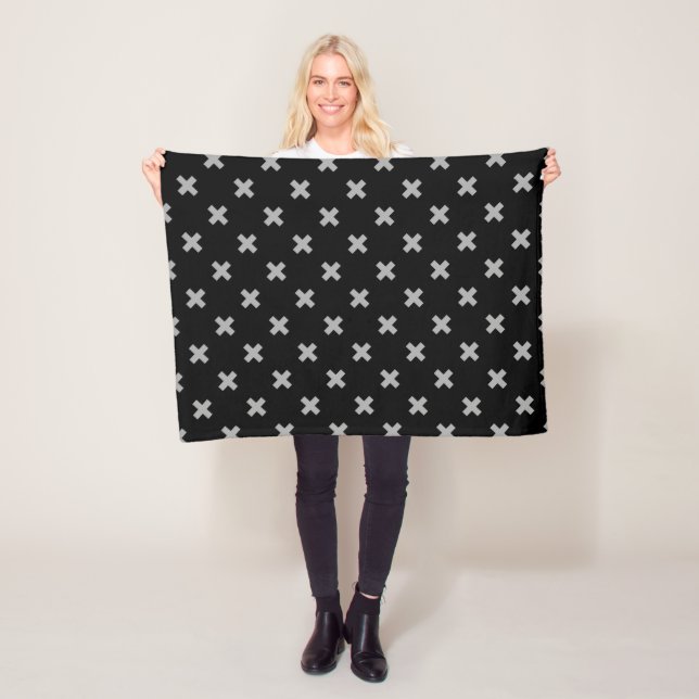 Grey cross stitches on black fleece blanket (In Situ)