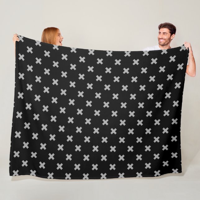 Grey cross stitches on black fleece blanket (In Situ)