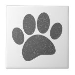 Grey Dog Paw Print Cartoon Old Paper Print Ceramic Tile<br><div class="desc">A cute dog paw print. Old paper,  vintage effect applied to the image. Grey version.
Custom ceramic tiles. Gift idea for dog lovers.</div>