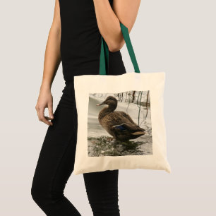 Grey duck on dark the lake tote bag
