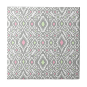 Grey, green, pink rhombuses on a white ceramic tile