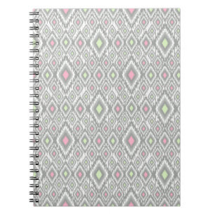 Grey, green, pink rhombuses on a white notebook