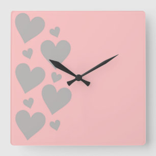 Grey hearts on a pink background square wall clock