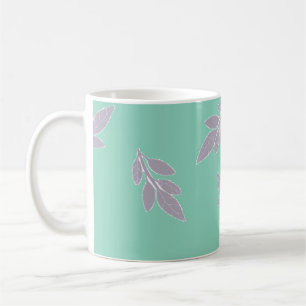 Grey leaves on green coffee mug