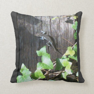 grey lizard in ivy on grey pillow