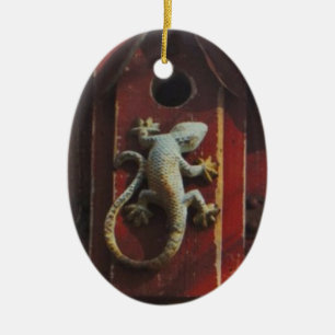 grey lizard on worn wood ceramic tree decoration