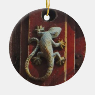 grey lizard on worn wood ceramic tree decoration
