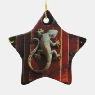 grey lizard on worn wood ceramic tree decoration