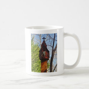 grey lizard on worn wood coffee mug