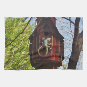 grey lizard on worn wood tea towel