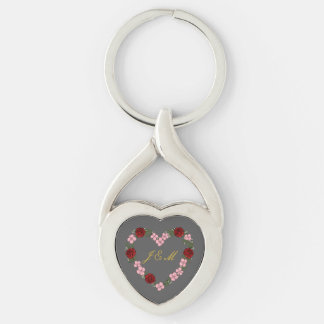 Grey metal keychain with pink and red heart
