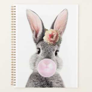 Grey rabbit blowing bubble gum with anemone flower planner