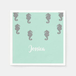 Grey seahorses on blue napkin