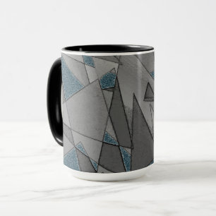 Grey triangle cutouts with rough dark blue pieces mug