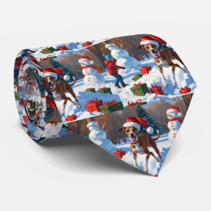 Greyhound Running in Snow with Christmas Hat Tie