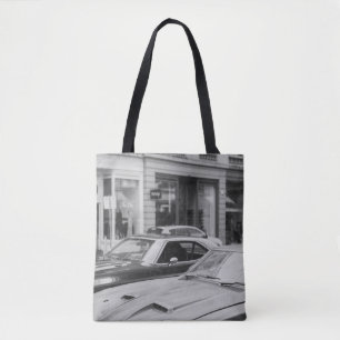 GREYSCALE PHOTOGRAPHY OF CARS ON ROAD BESIDE BUILD TOTE BAG