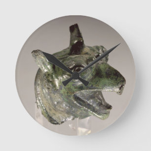 Griffin head, fragment of a cauldron attachment, f round clock
