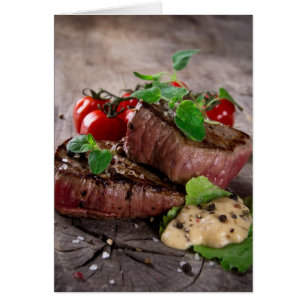 Grilled bbq steaks with fresh herbs and tomatoes