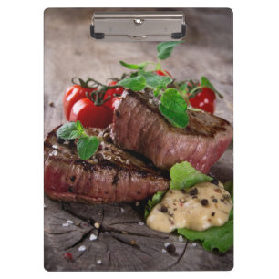 Grilled bbq steaks with fresh herbs and tomatoes clipboard
