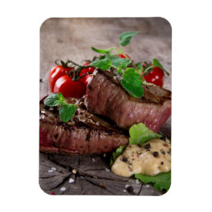 Grilled bbq steaks with fresh herbs and tomatoes magnet