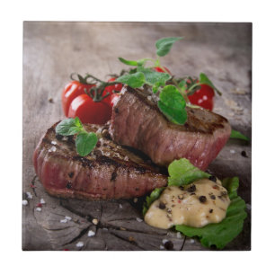 Grilled bbq steaks with fresh herbs and tomatoes tile