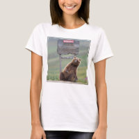 Grizzly Bear Plays With Sign