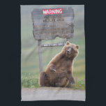 Grizzly Bear Plays With Sign Tea Towel<br><div class="desc">Grizzly bear scratches a roadside sign in Sable Pass,  Denali National Park,  Alaska</div>