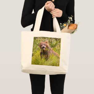 Grizzly cub grazing, Alaska Large Tote Bag