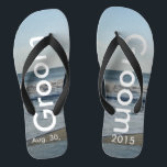 Groom Ocean Waves Beach Sand Thongs<br><div class="desc">Pretty Blue Sky with Light Fluffy White Clouds, Blue Sea, Crashing Ocean Waves and Beach Sand. Unisex Flip Flops with Groom and Date of Marriage written in a white colour text. PERSONALIZE with your Wedding DATE (or delete text). The wedding date is written in the sand. Shown with Wide Black...</div>